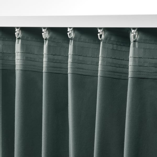 Darkening curtains with hooks for privacy and insulation.