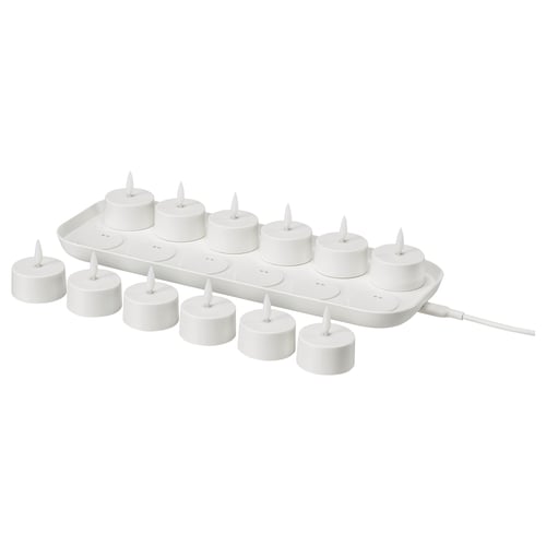SKATGÅS white led tealights with charging tray for safe, decorative lighting.