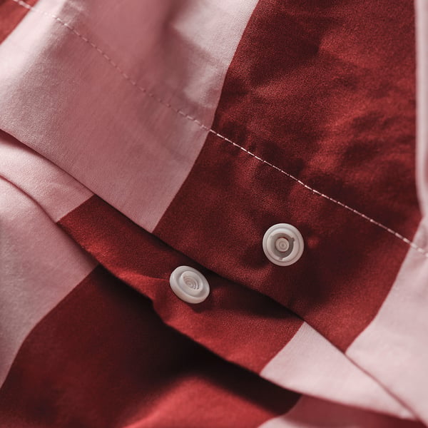 Red striped duvet cover with white buttons, crisp cotton blend, breathable material.
