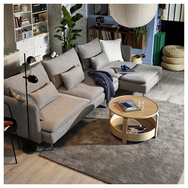 Modern living room with grey SÖDERHAMN sectional sofa, wooden coffee table, and black floor lamp.