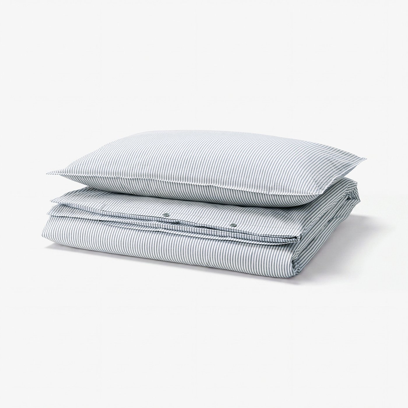 Stack of two blue and white striped cotton duvet covers. Folded in rectangle shape with clean lines and subtle vintage stripes.