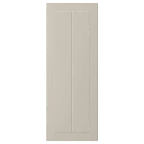 A beige STENSUND cabinet door with a smooth, framed design.