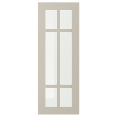 A beige STENSUND cabinet door with a grid glass design.
