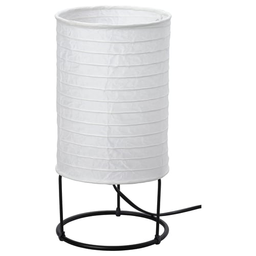 A STRANDAD table lamp, featuring a white rice paper shade, round black metal base, and diffuser.