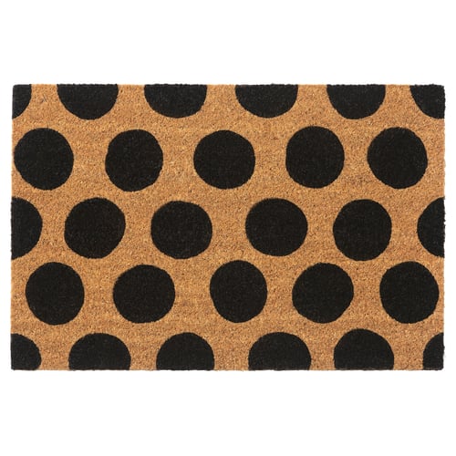 A TÅGFORDON doormat with black polka dots on a natural coir background. The mat is square-shaped and made from eco-friendly materials.