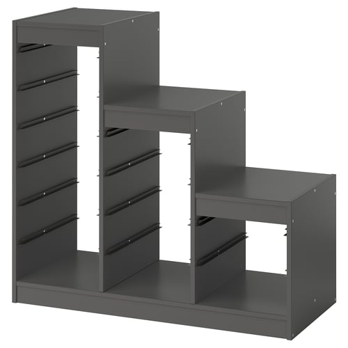 Depicts a dark grey TROFAST storage unit with multiple compartments for organising items, designed with a modular structure.
