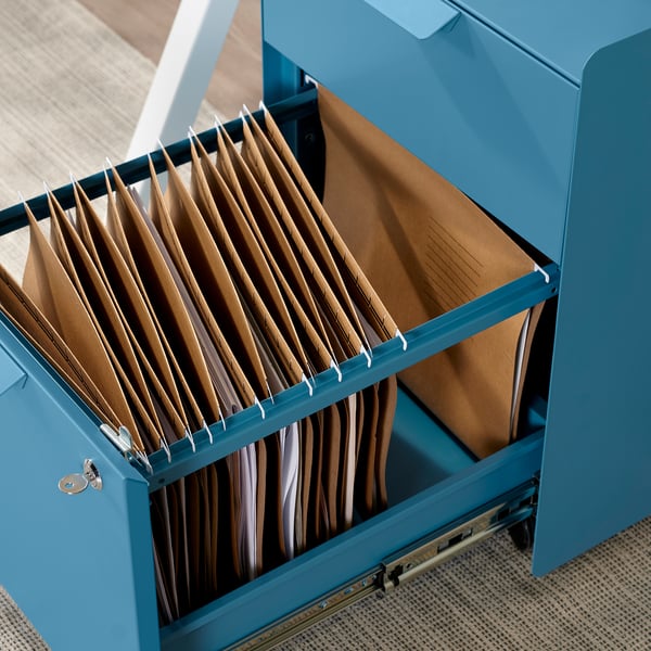 Blue filing cabinet with locked drawer, containing multiple paper files.