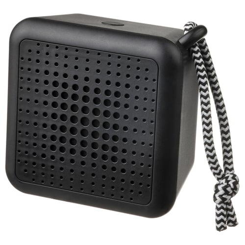 Black cube-shaped portable speaker with a zigzag patterned handle, featuring a perforated surface.