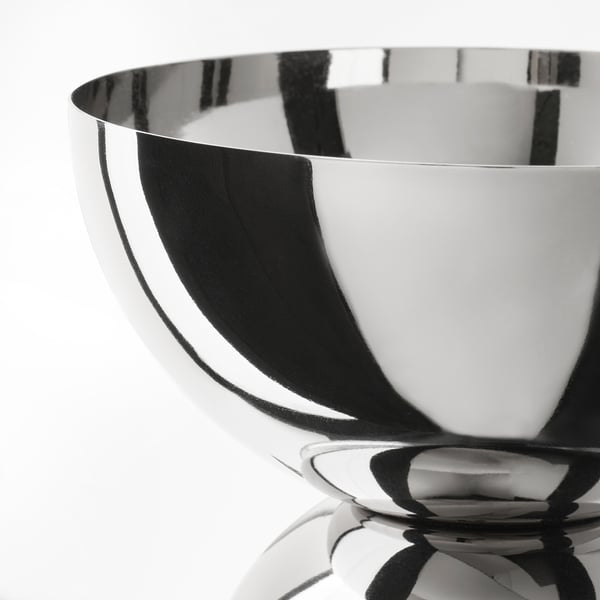 Sleek, polished metallic bowl-shaped lamp with reflective surface.