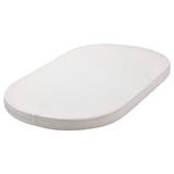 An oval white ÄLSKVÄRD baby mattress with a simple design, made from polyester and cotton materials.