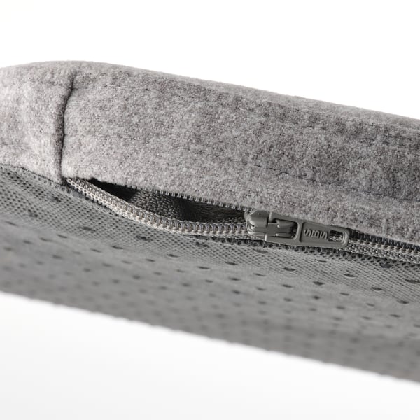 Close-up of grey chair pads zip, showing quality materials and durable extras.