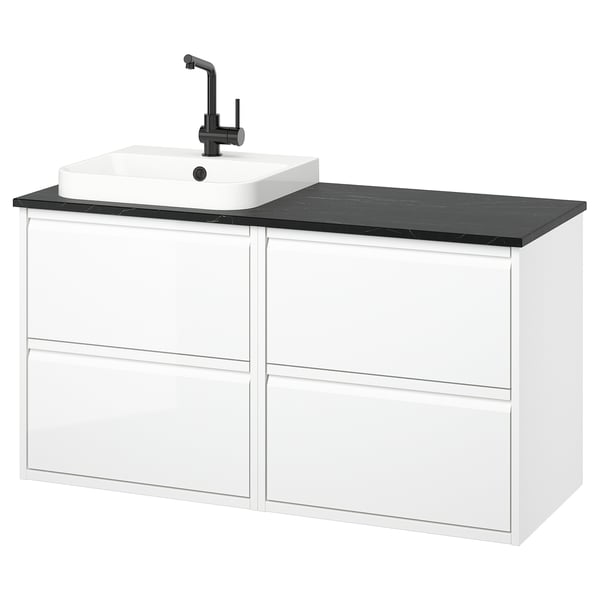 A modern, white ÄNGSJÖN vanity set with a black countertop and sink, featuring sleek drawers for storage.