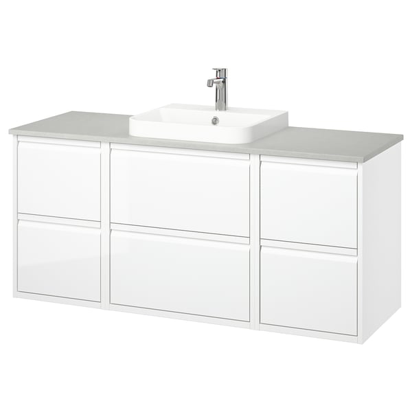 Modern white bathroom vanity by ÄNGSJÖN, sleek with drawer storage, light quartz countertop, single vessel sink, chrome fixtures.