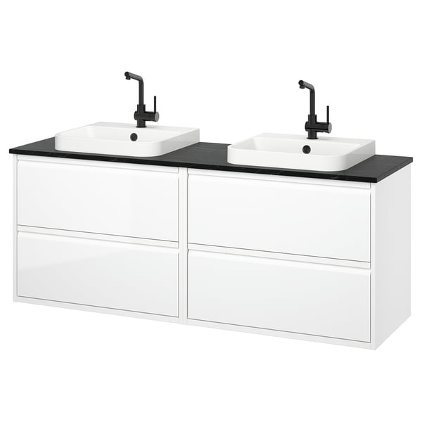 Modern white bathroom vanity with black countertop, two square bowls, black fixtures, sleek handles, and ample storage.
