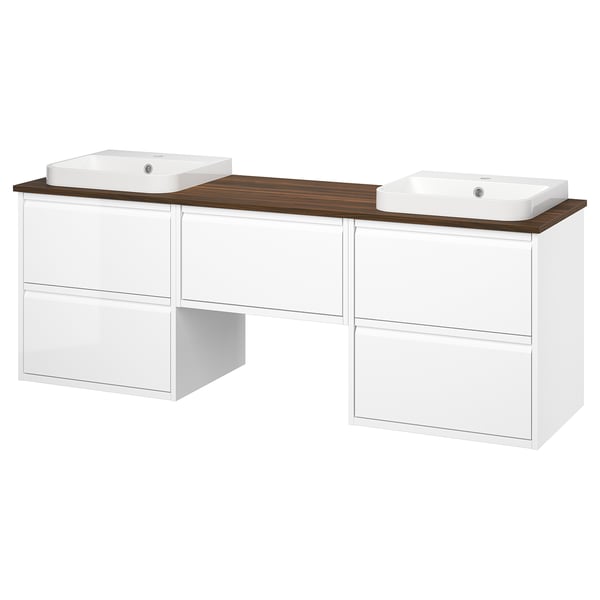 Double white vanity with wooden countertop, two sinks, and multiple drawers for storage. Modern and sleek design.
