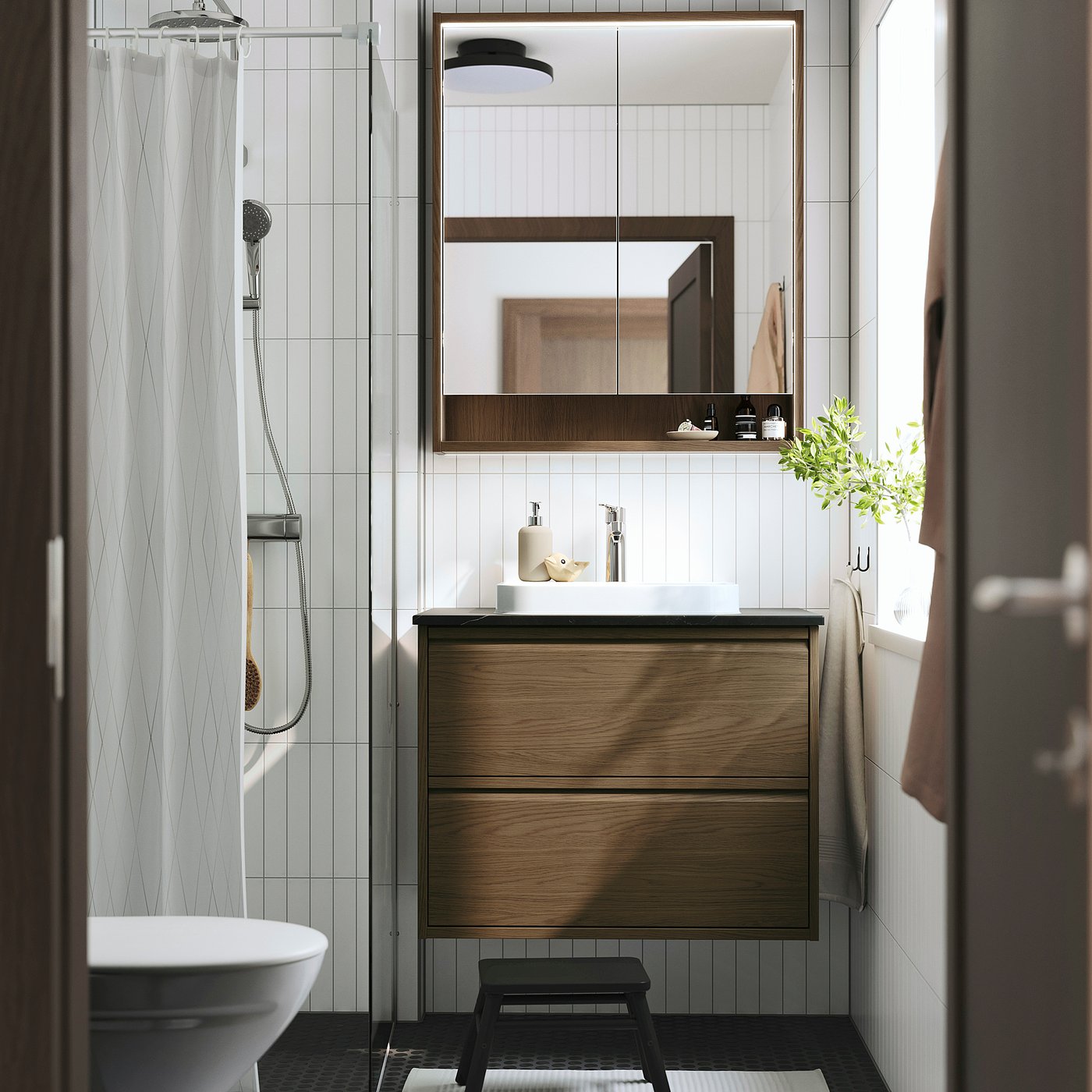 Wooden cabinet, white basin, silver tap, rectangle mirror, small stool, grey towels, minimalist design.