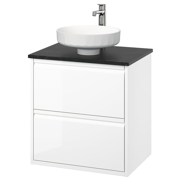 Modern white wall-mounted bathroom vanity with sleek black countertop and round white basin.