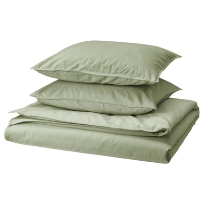 Green ÄNGSLILJA bed sheets, including duvet cover and pillowcases, neatly folded. Soft, pre-washed 100% cotton in earthy tone.