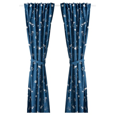 Blue glow-in-dark curtains with space-themed white patterns. Made from recycled polyester and cotton fabric, featuring tab headings and tie-backs.