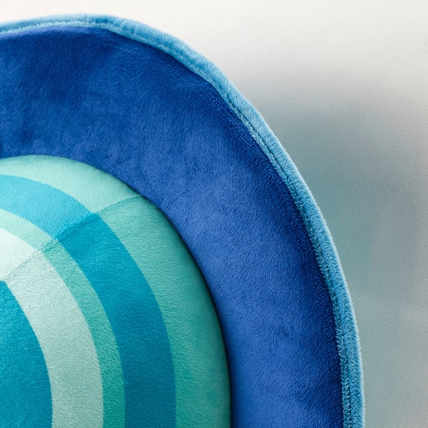 Circular blue and green striped cushion with plush texture, likely made from recycled materials.