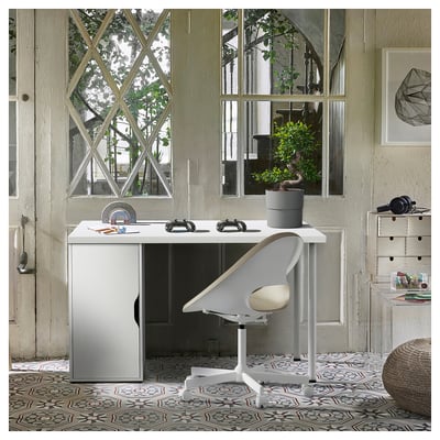 Modern white ALEX desk, sleek design, arched window backdrop.