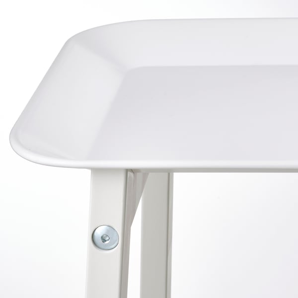 White plant stand close-up, sleek tray, sturdy legs.