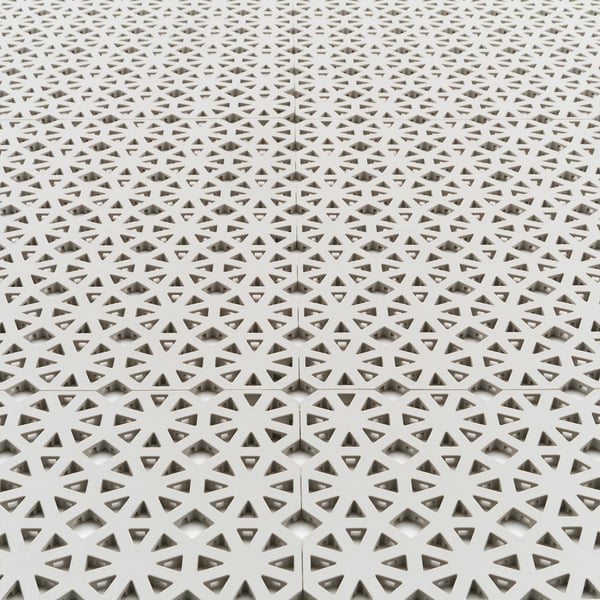 White geometric floor panels, precisely cut and fitted together, showcasing high-quality design and durability.