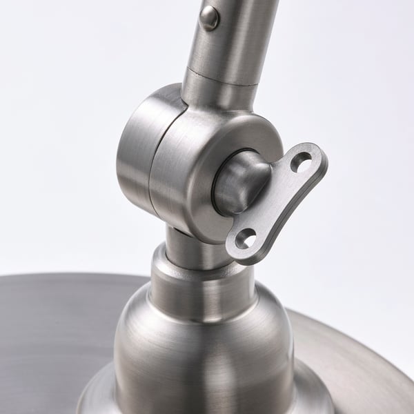 Metal lamp joint detail, brushed nickel finish, adjustable swivel, high-quality look.