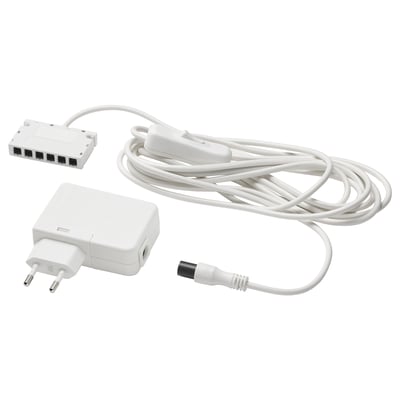A white ANSLUTA power adapter set including a driver, a cord, and a plug, designed to control up to six light sources with one switch.