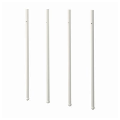 Four white pole-shaped objects, likely part of furniture, arranged in a row.