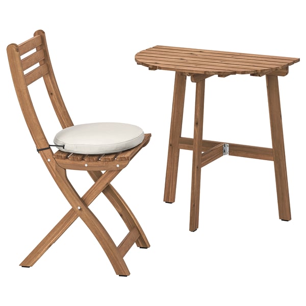 ASKHOLMEN: wooden outdoor table and folding chair with cushion. Natural brown, durable acacia wood.