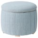 Round, light blue fabric pouffe with pleats and wooden legs.
