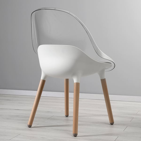 Modern white chair with sleek wooden legs, designed for comfort and style.