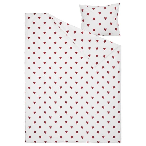 A white bedding set with red heart patterns, made from cotton. Includes a duvet cover and pillowcase.