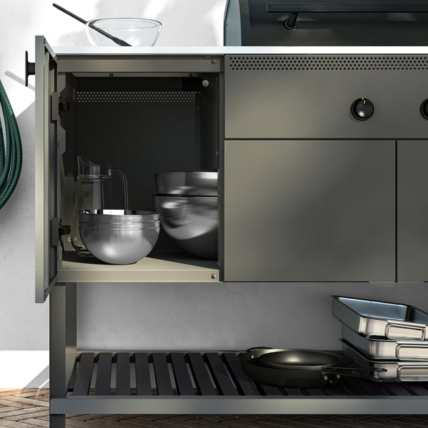 Modern outdoor kitchen with closed storage, soft-closing hinges, and steel frame. Includes thermometer and adjustable feet.