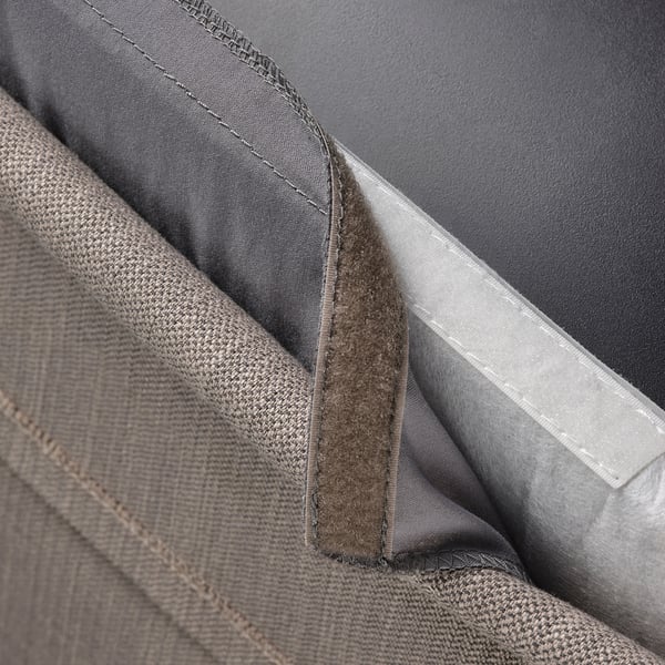A close-up of a removable, washable cover for the BERGMUND chair, highlighting its easy-clean and durable fabric.