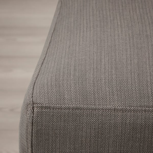 Close-up of textured, grey fabric seat in dining chair. Soft, woven material with subtle stitching visible.