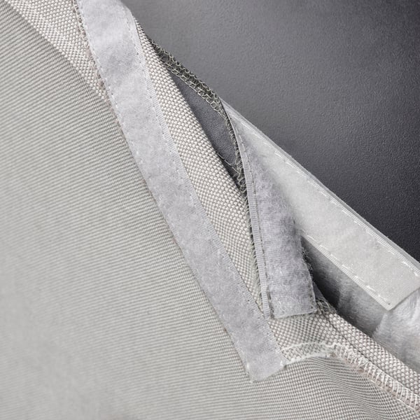 Close-up of washable, grey BERGMUND chair cover, highlighting soft, removable fabric.