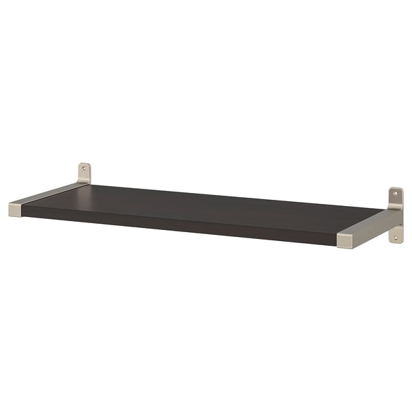 A BERGSHULT wall shelf, black, supported by nickel-plated aluminum brackets. It has a sleek, rectangular design with one beveled edge.