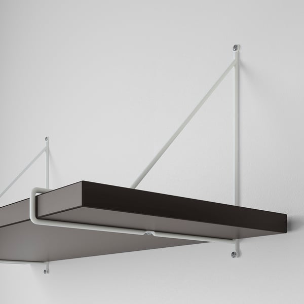 Modern wall-mounted shelf with white metal brackets. Two dark shelves, one angled, one flat, securely fixed to a white wall.