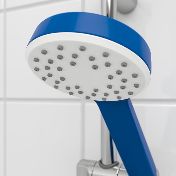 Blue and white handheld showerhead with multiple small holes, mounted on a silver holder.