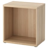 A BESTÅ wooden storage unit in light oak colour, featuring an open rectangular design with adjustable feet.