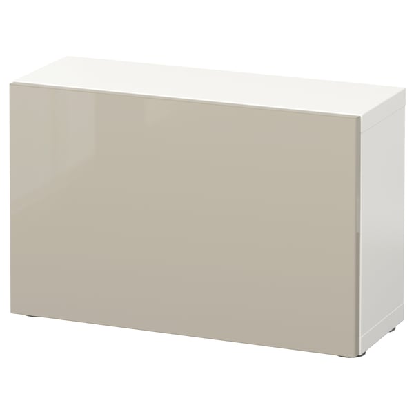 A white BESTÅ storage unit. Its sleek, rectangular, with a glossy finish, and clean design.
