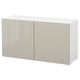 White BESTÅ cabinet with beige glossy doors, rectangular, modern design.