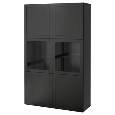 Black BESTÅ cabinet with glass doors and dark interior, modern and sleek design.