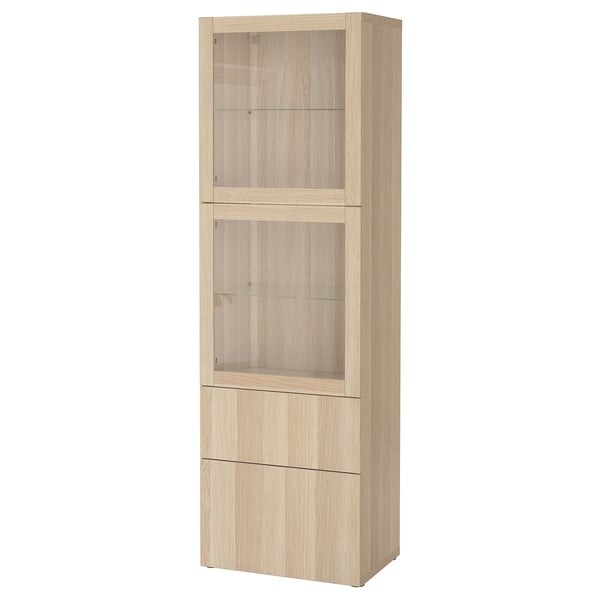 IKEA BESTÅ tall light oak display cabinet with glass doors and drawers.