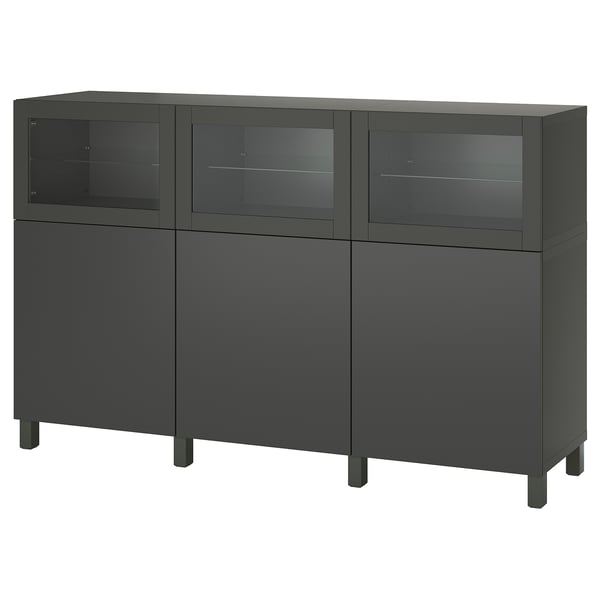 Black BESTÅ storage unit: sleek design with glass doors, adjustable shelves, metal legs.