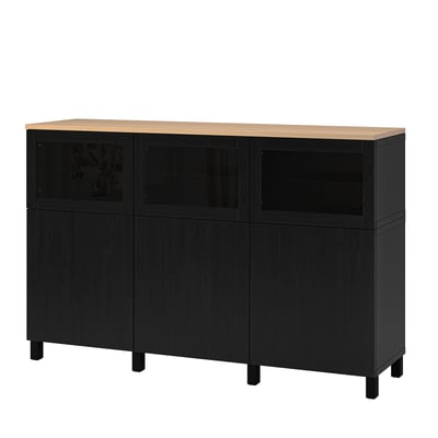 Black BESTÅ cabinet with oak top, four doors, two glass, sturdy legs, adjustable shelves.