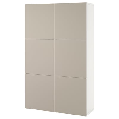 A tan-colored BESTÅ cabinet with adjustable shelves and soft-close doors, showcasing a modern, rectangular design.