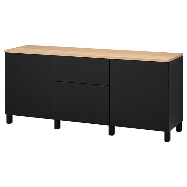 Is of a black and light-wood-colored BESTÅ sideboard with three sections, adjustable shelves, and two drawers.